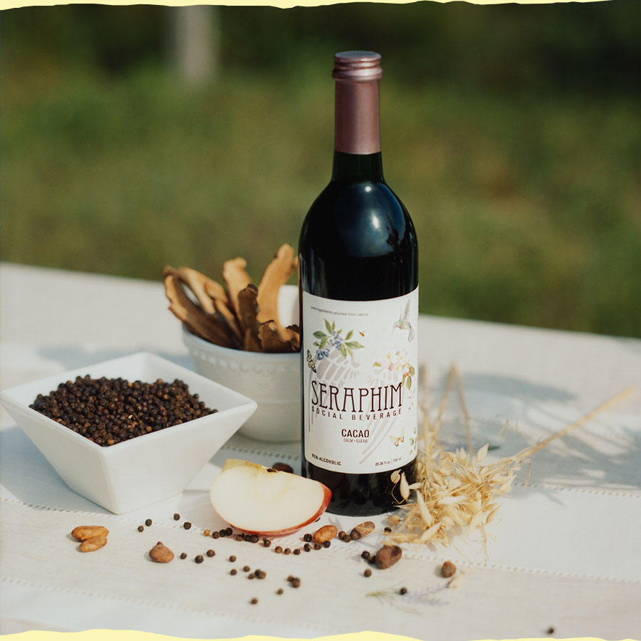 Bottle of Cacao on a table with organic ingredients