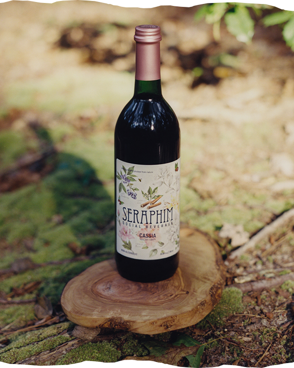 Bottle of Seraphim Social Beverage, a non-alcoholic social wine alternative made from pure ingredients. Featured flavors in image: a bottle of Cassia