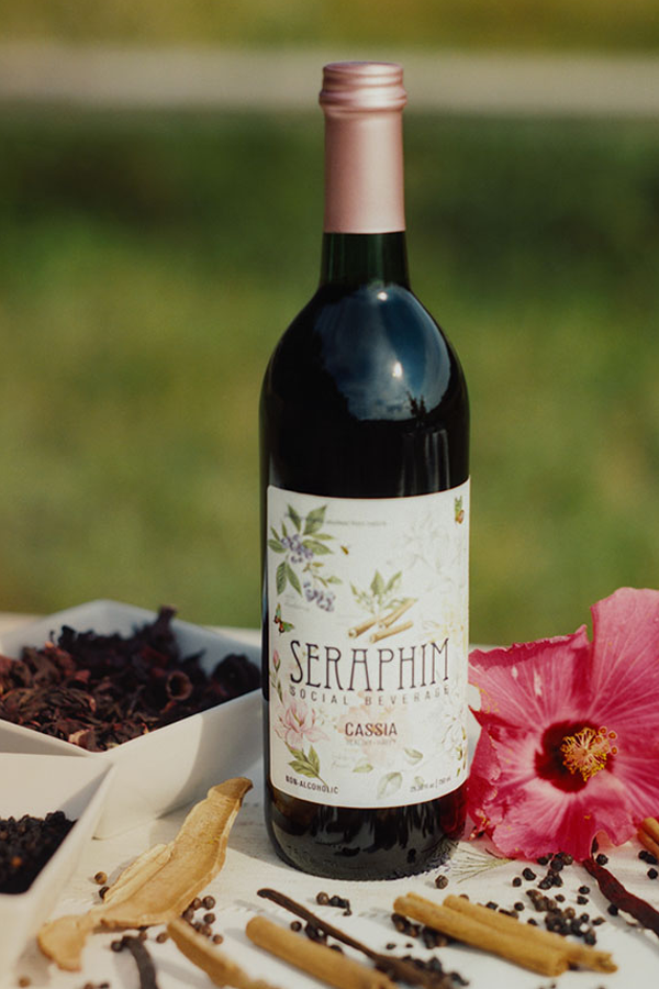 Bottle of Cassia on a table with organic ingredients